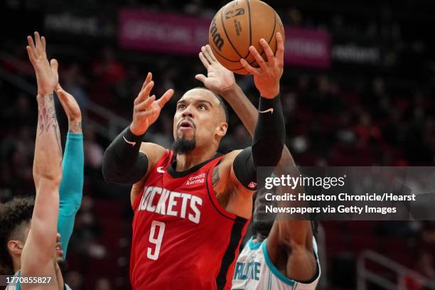 Houston Rockets forward Dillon Brooks drives to the basket while Charlotte Hornets guard LaMelo Ball defends during the second half of an NBA game...