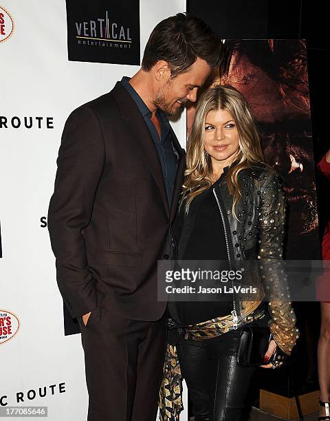 Josh Duhamel and Fergie attend the premiere of "Scenic Route" at Chinese 6 Theater Hollywood on August 20, 2013 in Hollywood, California.