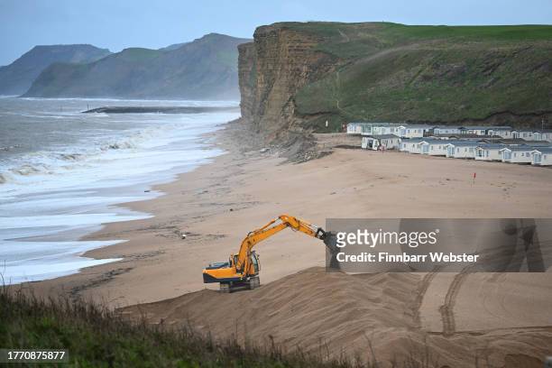 Mechanical digger works on the beach at Freshwater Beach Holiday Park, on November 02, 2023 in Burton Bradstock, Dorset. Storm Ciaran swept across...