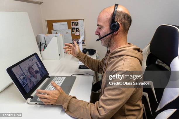 a man having a videocall - two people video conferencing stock pictures, royalty-free photos & images