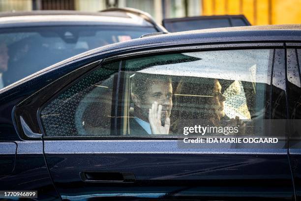 Denmarks Crown Prince Frederik and Crown Princess Mary leave in their car after their visit of the Danish Architecture Center along with the Spanish...