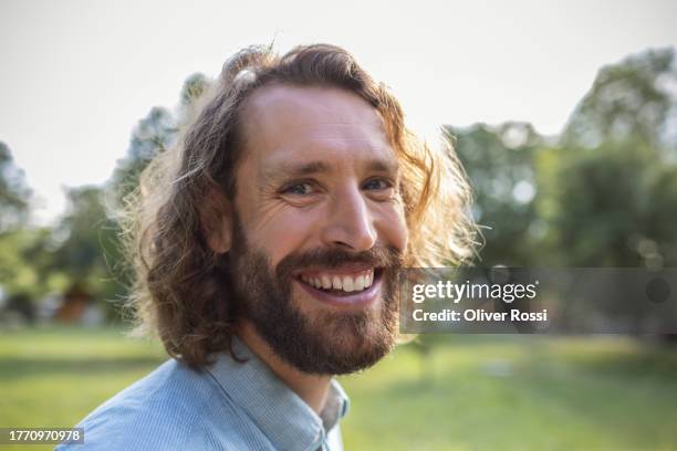 portrait of happy man in nature - facial hair stock pictures, royalty-free photos & images
