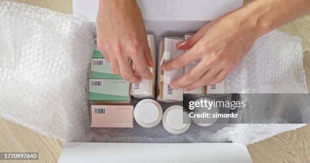 man removing medicine - prescription home delivery stock pictures, royalty-free photos & images