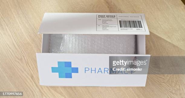 close-up of pharmacy box - prescription home delivery stock pictures, royalty-free photos & images