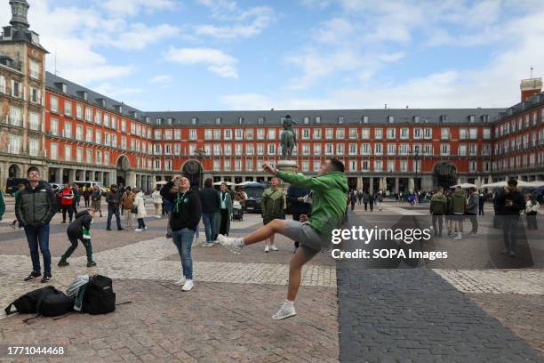 Celtic fan from Scotland kicks a ball in the main square of Madrid, where the Scottish fans have gathered hours before the Champions League match...