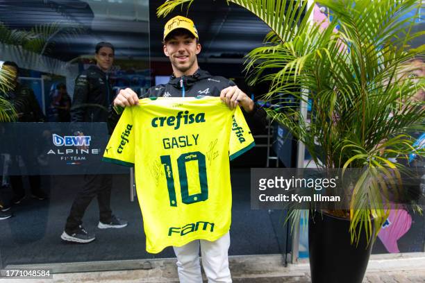 Pierre Gasly of France and Alpine F1 with a customised Sociedade Esportiva Palmeiras jersey during previews ahead of the F1 Grand Prix of Brazil at...