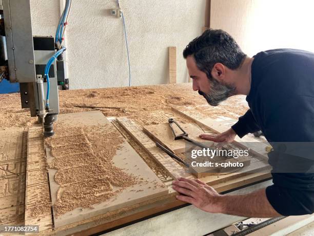 man working on cnc milling machine - milling cutter stock pictures, royalty-free photos & images