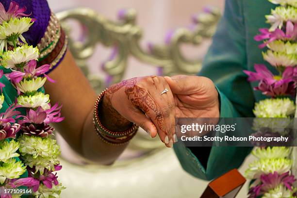 hands of engagement - mehndi stock pictures, royalty-free photos & images