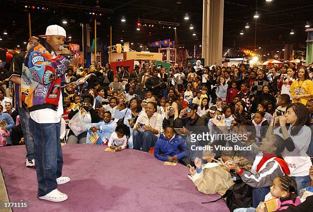 Musician/actor LL Cool J reads to children from his book "And the Winner Is" during the NBA All-Star Jam Session event "Read to Achieve" celebration...