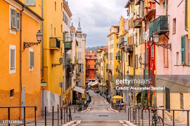 multi-colored vibrant streets of nice old town, french riviera, france - nice old town stock pictures, royalty-free photos & images