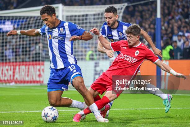 Danny Namaso and João Mário of Porto and Arbnor Muja of Antwerp in action during the UEFA Champions League match between FC Porto and Royal Antwerp...