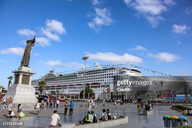 The Panama-flagged cruise ship "Pacific World", sailed by Japan-based luxury cruise operator and NGO "Peace Boat", is docked at the port of Port Said...