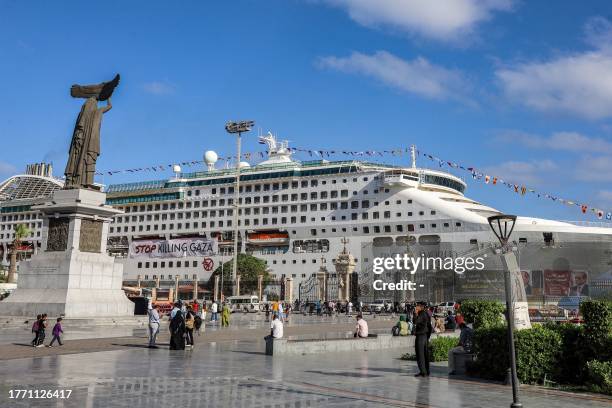 The Panama-flagged cruise ship "Pacific World", sailed by Japan-based luxury cruise operator and NGO "Peace Boat", is docked at the port of Port Said...