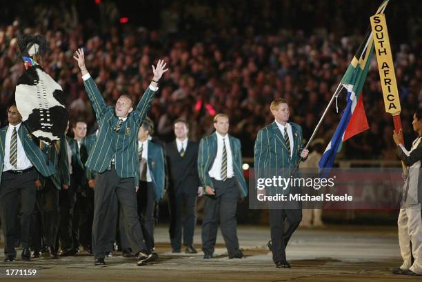 The South African cricket team enter the stadium led by Shaun Pollock while Allan Donald waves to the crowd during the ICC Cricket World Cup Opening...