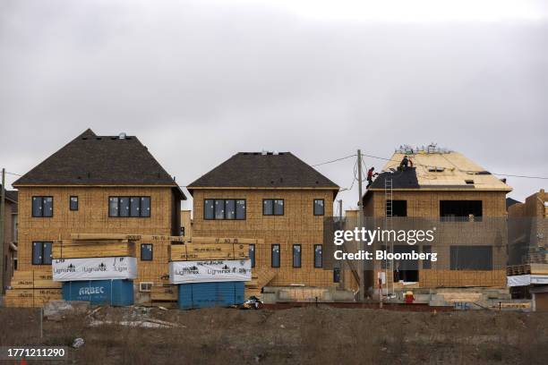 Homes under construction in Richmond Hill, Ontario, Canada, on Tuesday, Nov. 7, 2023. Canadian home prices will continue declining into the beginning...