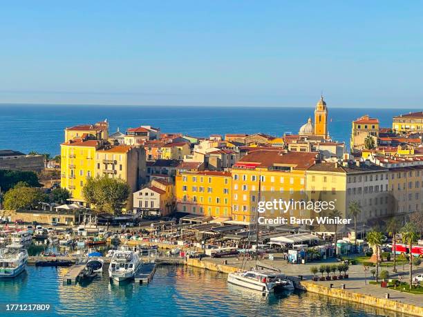 golden early morning sunlight on modern harborside buildings in ajaccio - ajaccio stock pictures, royalty-free photos & images