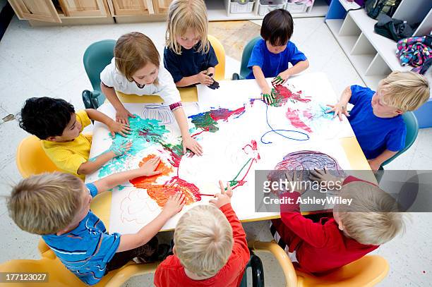 children painting together - preschool art stock pictures, royalty-free photos & images