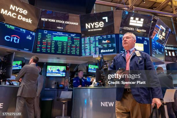 Traders work on the floor of the New York Stock Exchange on November 02, 2023 in New York City. Following more strong corporate results and a growing...