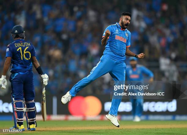 Mohammed Siraj of India celebrates the wicket of Dimuth Karunaratne of Sri Lanka during the ICC Men's Cricket World Cup India 2023 between India and...