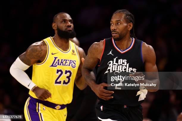 Kawhi Leonard of the Los Angeles Clippers looks on against LeBron James of the Los Angeles Lakers during the first quarter at Crypto.com Arena on...