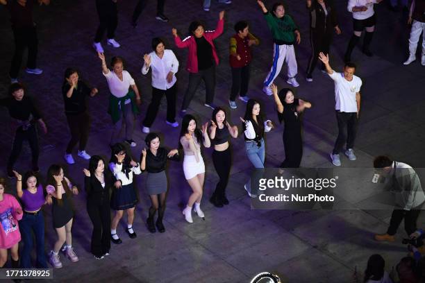 Citizens perform a square dance in Guiyang, Guizhou province, China, Nov 7, 2023.