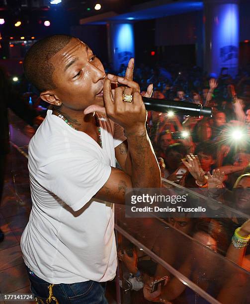 Pharrell Williams performs at PURE Nightclub on August 20, 2013 in Las Vegas, Nevada.Ê