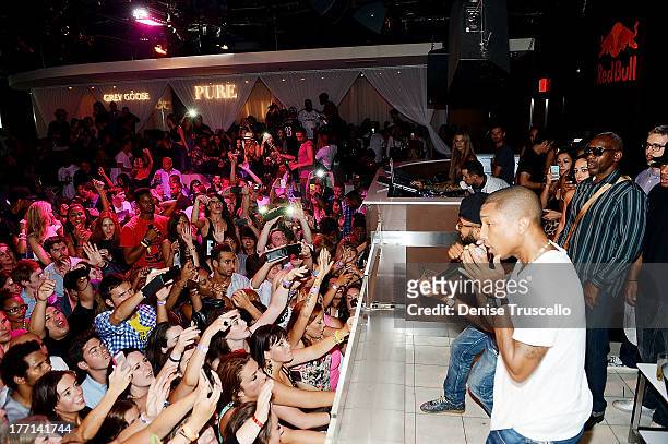 Pharrell Williams and Swizz Beatz perform at PURE Nightclub on August 20, 2013 in Las Vegas, Nevada.Ê