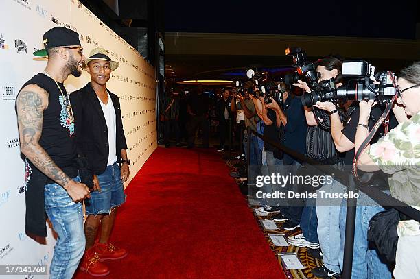 Swizz Beatz and Pharrell Williams arrive at PURE Nightclub on August 20, 2013 in Las Vegas, Nevada.Ê