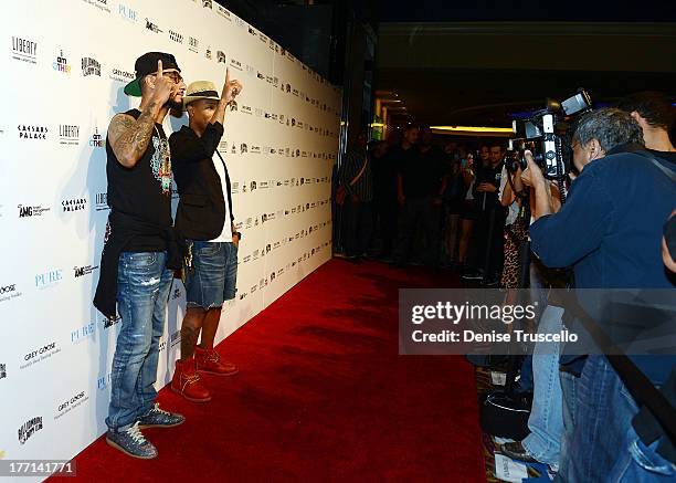 Swizz Beatz and Pharrell Williams arrive at PURE Nightclub on August 20, 2013 in Las Vegas, Nevada.Ê