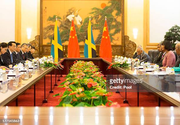 Jamaican Prime Minister Portia Simpson Miller and Chinese Premier Li Keqiang attend talks at the Great Hall of the People, on August 21, 2013 in...