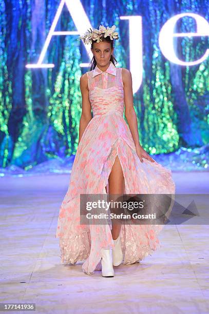 Model showcases designs by Aje on the runway at the MBFWA Trends show during Mercedes-Benz Fashion Festival Sydney 2013 at Sydney Town Hall on August...