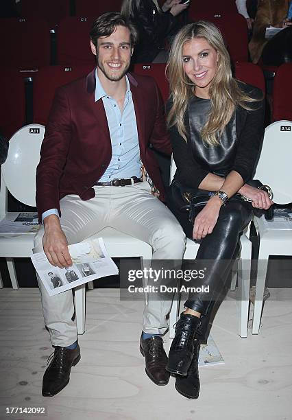 Zac Stenmark and Laura Csortan watch the MBFWA Trends show during Mercedes-Benz Fashion Festival Sydney 2013 at Sydney Town Hall on August 21, 2013...