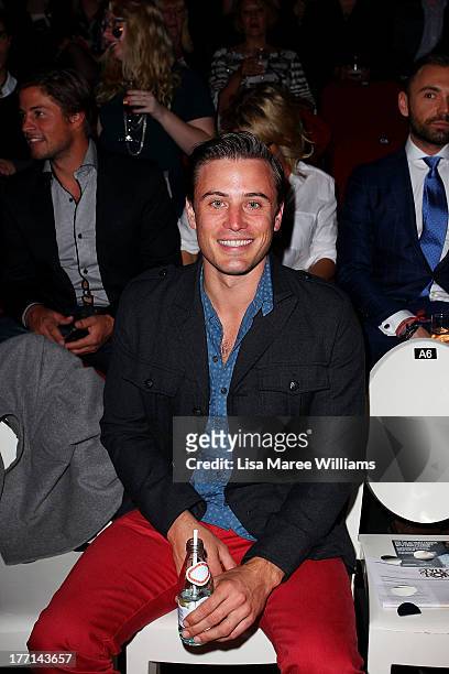 James Tobin watches the MBFWA Trends show during Mercedes-Benz Fashion Festival Sydney 2013 at Sydney Town Hall on August 21, 2013 in Sydney,...