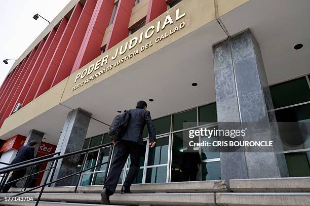 An employee arrives at the Courthouse of Callao, where 19-year-old Briton Melissa Reid and 20-year-old Irishwoman Michaella McCollum Connolly...