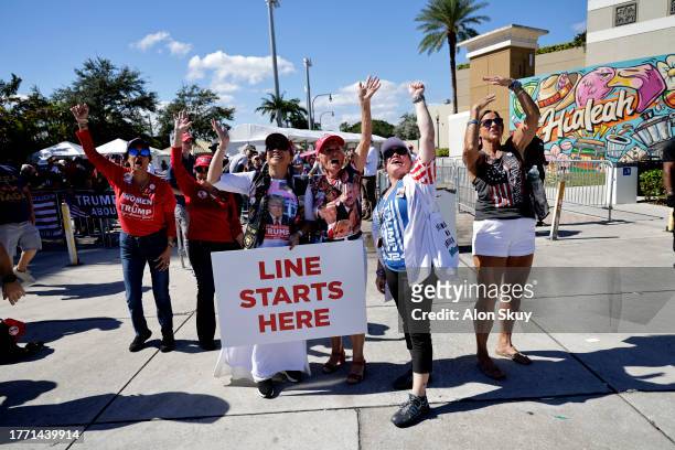 Supporters arrive at the venue as former U.S. President Donald Trump is set to deliver remarks at The Ted Hendricks Stadium at Henry Milander Park on...