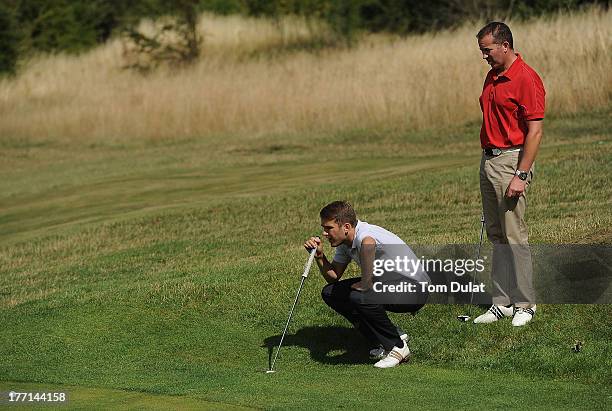 Gary Laird of Wexham Park Golf Courses and Craig Ainsley of Wexham Park Golf Courses line up a putt on the 2nd green during the Golfbreaks.com PGA...