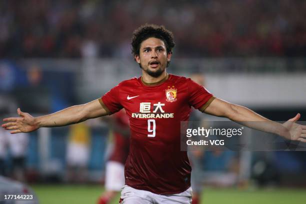 Elkeson of Guangzhou Evergrande celebrates after scoring his team's second goal during the AFC Champions League quarter-final match between Guangzhou...