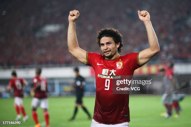 Elkeson of Guangzhou Evergrande celebrates after scoring his team's second goal during the AFC Champions League quarter-final match between Guangzhou...