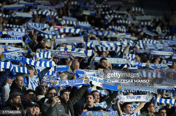 Real Sociedad's supporters cheer prior the UEFA Champions League group D football match between Real Sociedad and SL Benfica at the Reale Arena...