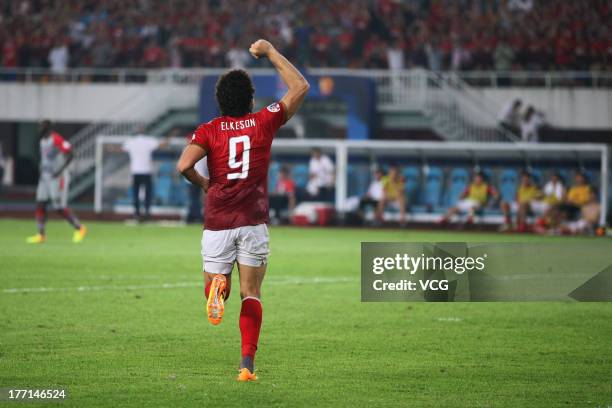 Elkeson of Guangzhou Evergrande celebrates after scoring his team's second goal during the AFC Champions League quarter-final match between Guangzhou...