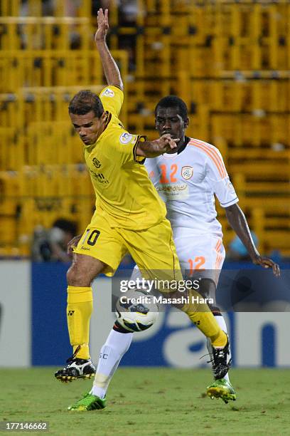 Leandro Domingues of Kashiwa Reysol and Abdulmalek Al Khaibri of Al Shabab compete for the ball during the AFC Champions League Quarter Final 1st Leg...