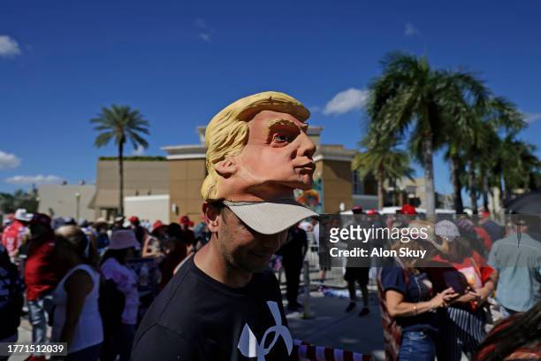 Supporters arrive at the venue as former U.S. President Donald Trump is set to deliver remarks at The Ted Hendricks Stadium at Henry Milander Park on...