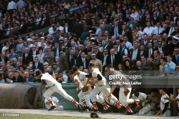 World Series: Overall view of Boston Red Sox players taking the field from dugout during game vs St. Louis Cardinals at Fenway Park. Boston, MA...