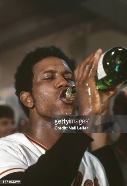 World Series: Closeup of Baltimore Orioles Paul Blair victorious, drinking champagne during locker room celebration after winning Game 5 and...