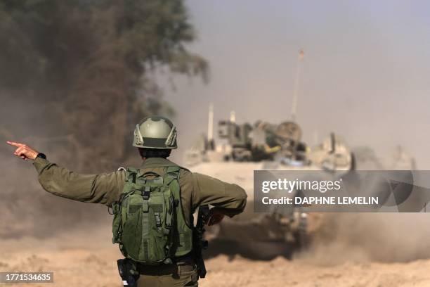 Israeli troops are pictured near the border fence between Israel and the Gaza Strip ahead of an operation in the north of the Palestinian enclave on...