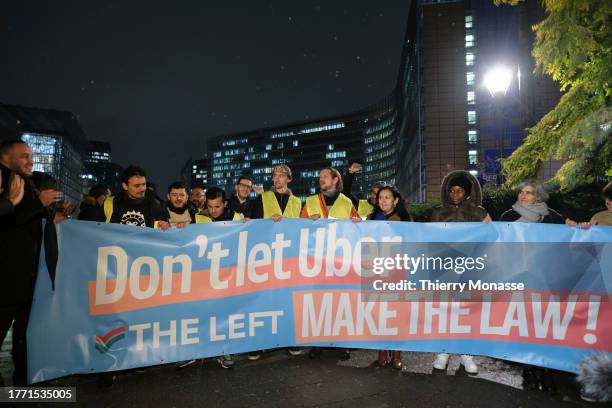 Gig workers demonstrate under the slogan: 'Don't let Uber make the law' in Schuman roundabout on November 8, 2023 in Brussels, Belgium. Six bicycle...