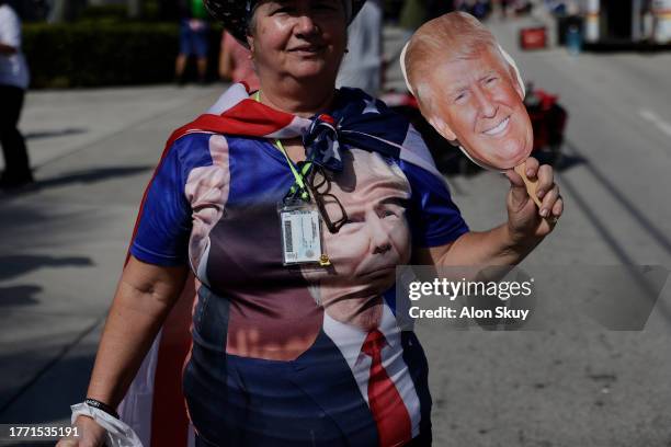 Supporters arrive at the venue as former U.S. President Donald Trump is set to deliver remarks at The Ted Hendricks Stadium at Henry Milander Park on...