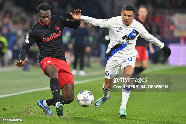 Salzburg's Austrian defender Samson Baidoo and Inter Milan's Chilean forward Alexis Sanchez vie for the ball during the UEFA Champions League Group D...