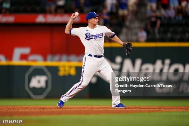 Corey Seager of the Texas Rangers throws the ball during a game against the Los Angeles Angels at Globe Life Field on August 15, 2023 in Arlington,...
