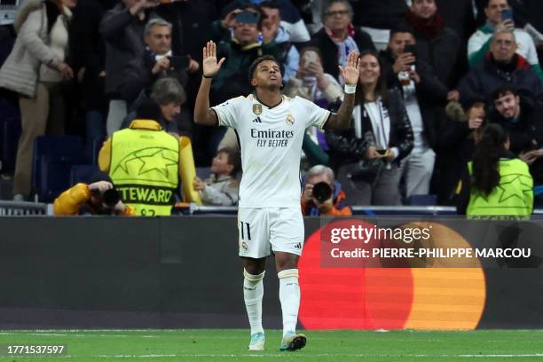 Real Madrid's Brazilian forward Rodrygo celebrates scoring his team's third goal during the UEFA Champions League group C football match between Real...